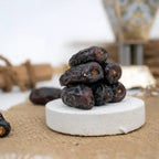 Stack of dates on a white stone surface with a blurred background